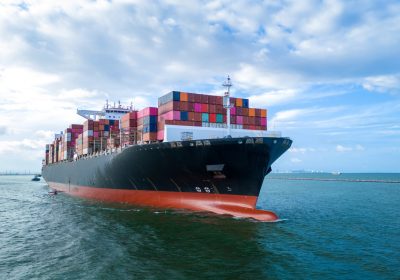 aerial-side-view-of-cargo-ship-carrying-container-2025-01-16-08-18-36-utc
