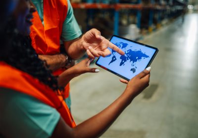 warehouse-workers-using-digital-tablet-showing-wor-2025-01-27-19-16-52-utc